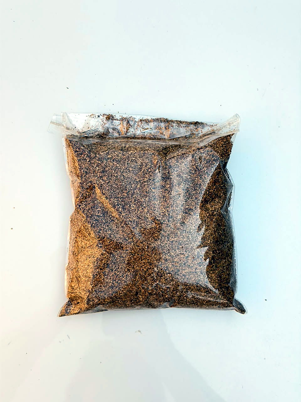 Fine-cut lamina sample of FCV tobacco, sealed bag